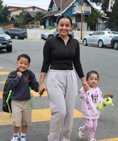 Photo courtesy of Camino Nuevo Charter Academy: A mother walking to the school with her children.